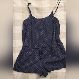 Cute dark blue and orange-red patterned romper.